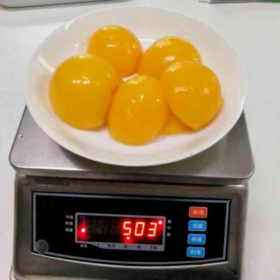 China Canned yellow halves of canned peaches in light syrup fresh peaches in tin packaging for sale