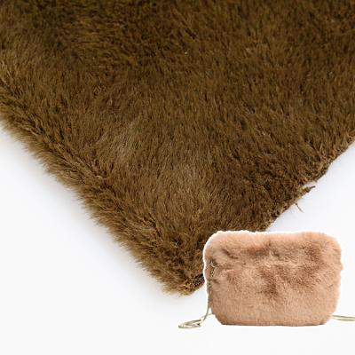 China 100% Memory Polyester Faux Fur Heavy Brown Brushed Fancy Knit Fabric For Women Coat Dress In Stock for sale