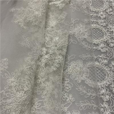 China Breathable Floral White Cheap Heavy Embroidered Lace Fabrics For Dress Dress for sale