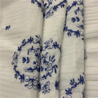 China Sustainable Wholesale Cheap White Knitted Fabric Blue Embroidered Online Floralace Fabrics for sale