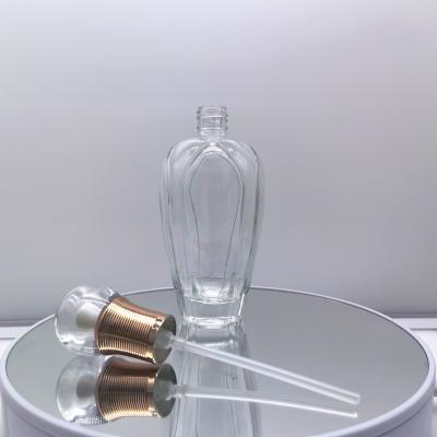 China Hot Sale 100ML Cosmetic Glass Bottle With Spray Pump Liquid Perfume Bottle for sale