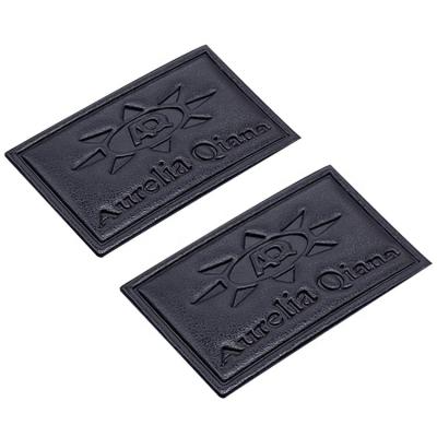 China Sustainable high quality rectangle embossed black sew on real leather label patches for sale