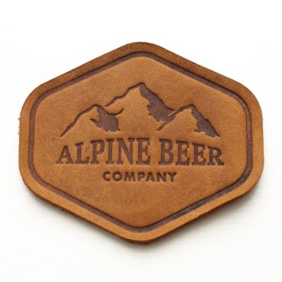 China Custom Viable Logo Clothing Brown Soft Cow Leather Label, Laser Cut Shape Embossed Printed Hat Leather Patch for sale