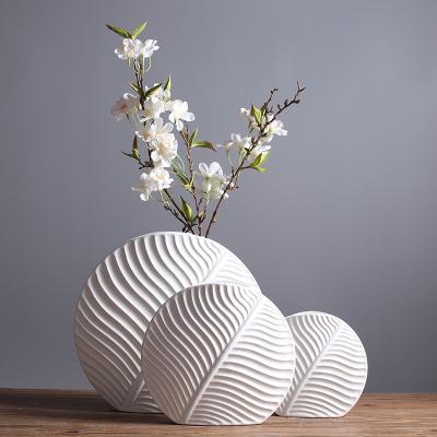 China Nordic Modern White Matte Leaf Ceramic Vases Art Vases For Home Decor Unique Flower Art Porcelain Decoration For Home for sale