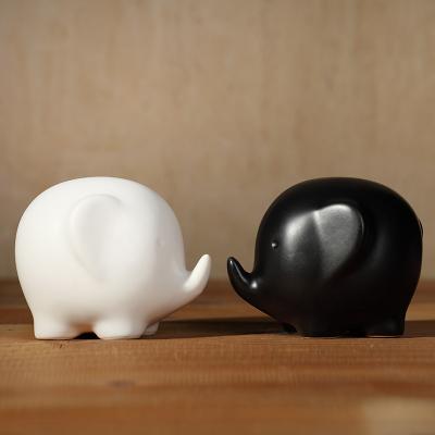 China White and black piece of modern simple decorative animal sculpture in Europe tabletop decoration home statue decor elephant pairs for sale