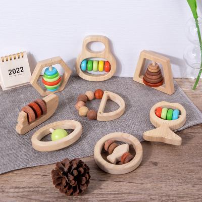 China Toddler Musical Puzzle Toy Wooden Montessori Education Toy Baby First Can Bite Wooden Bell Handle Toy Rattle Soothing Newborn Wooden Toys for sale