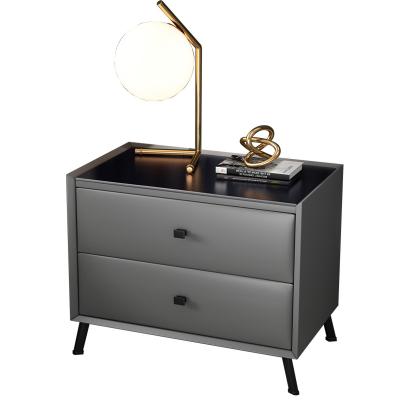 China Nordic luxury leather black glass bedside light bedside table simple modern solid wood bedroom solid wood storage cabinet for sale