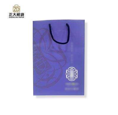 China Eco-friendly Custom Logo Printed Shopping Paper Packaging With Handle for sale