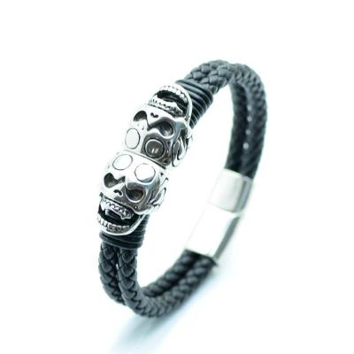 China FASHIONABLE factory European men's leather jewelry wholesale punk and American woven bracelet with double alloy skull for sale