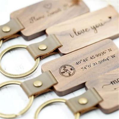 China 2021 Eco-friendly Hot Sale Craft Gift Wooden Key Chain Laser Engraved Logo Metal Wooden Keychain Customized for sale