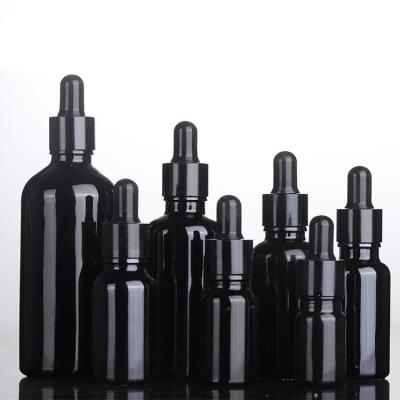 China Small Dark Black Round Cosmetic Glass Bottle 10ML 20ML 30ML 50ML 100ML Hair Body Essential Oil Dropper Bottle for sale