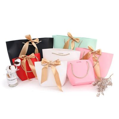 China Recyclable Clothing Packaging Shopping Bag Small Thank You Paper Gift Bag With Ribbon Handle for sale