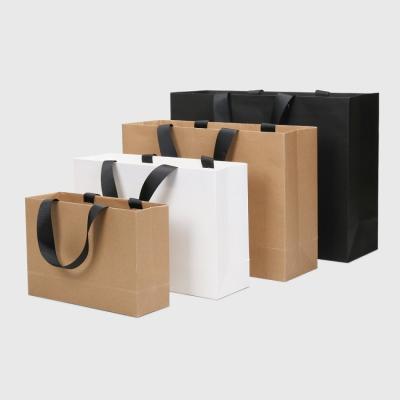 China Recyclable Luxury Gift Wrapping Paper Shopping Bag Custom Logo Clothing Packaging Paper Bag With Ribbon Handle for sale