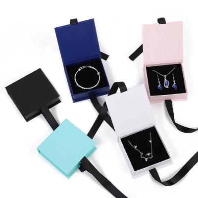 China Recycled Materials Eye Ring Packaging Boxes Custom Logo Necklaces Earrings Bracelet Luxury Small Jewelry Box With Ribbon for sale