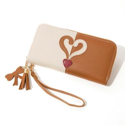 China Latest Ladies Clutch Card Holder Women Waterproof Leather Long Wallet With Tassel for sale