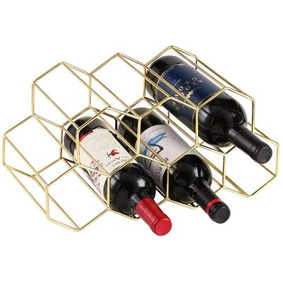 China Nordic Style Table Top Freestanding Honeycomb Gold 7 Bottles Metal Wine Rack For Restaurant Home Bar for sale