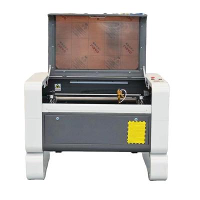 China Water Cooled Laser Cutter 7050 CO2 Laser Machine 7050 Lazer Engraving Machine For Acrylic Wood Leather for sale