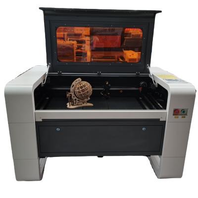 China Laser CUTTING hot 6040 laser engraving machine for engraving crafts bamboo fabric and other non-metallic materials for sale