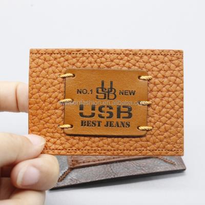 China Custom Fashion ODM TS CLOTHING Jeans Metal Label PU Leather Patch For Garment for sale