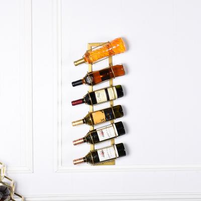 China Viable Industrial Modern Gold Wine Rack Metal Wine Bottle Holder Decorative Hanging Rack For Wall Mounted for sale