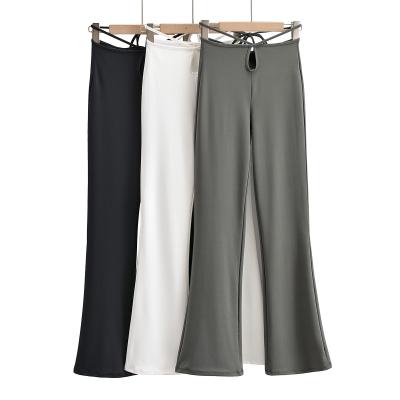 China high-waist ladies casual breathable Anti-wrinkle pants water drop hollow cross strap tightly flared pants for sale