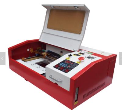 China Mini 4040 Trees Desktop MDF Factory Price Laser CUT CO2 40w Tube Laser Wood Stamp Making Machine Mini Engraving Machine CO2 Laser DA3020 for sale