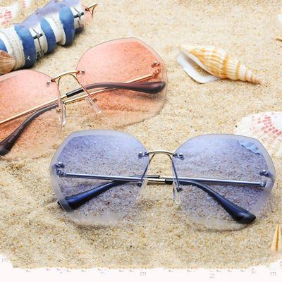 China Internet Celebrity Recommend Alloy Frame Round Cut Lens Women New Arrivals Tinted Rimless Sunglasses 2021 for sale