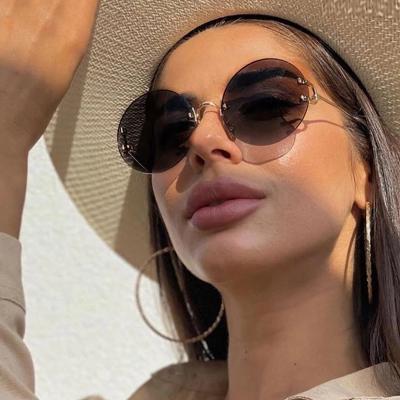 China Internet Celebrity Recommend Stylish Rimless Round Tinted Lens Women Acetate Famous Brand Sunglasses 2021 for sale