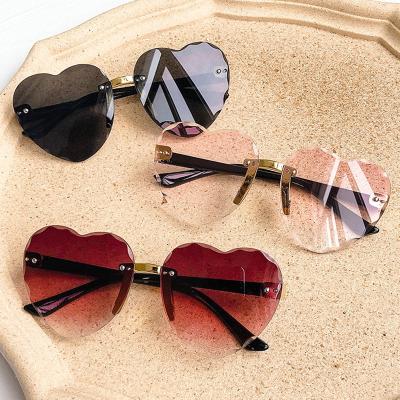 China High End Exquisite Colored Glass Products Heart Shape Kids Rimless Sunglasses Item High Quality Material 2021 Kids Sun Glasses for sale