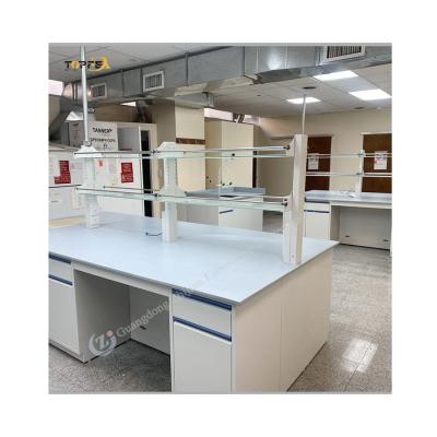 China Adjustable White Laboratory Island Bench All Steel Lab Bench With 2 Shelves And 4 Wheels for sale