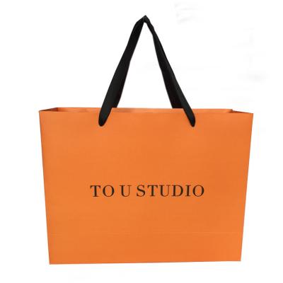 China Recycled Materials Wholesale Customized Color And Design Luxury Tote Paper Bag for sale