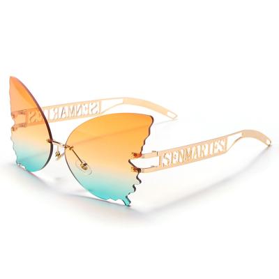 China Fashion sunglasses shape personality big frame women's butterfly rimless sunglasses multicolor sunglass UV400 to protect for sale