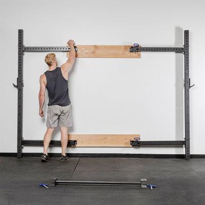 China Convenient Home / Gym Wall Mounted Folding Squat Rack High Quality Bodybuilding Household Training Strength for sale