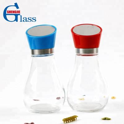 China Food factory direct sale frying oil bottle transparent glass bulb shaped spice glass jar with new design lid for sale