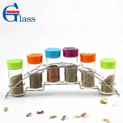 China Sustainable Clear Glass Cylinder Jar Kitchen Spice Rack Set With Lid for sale