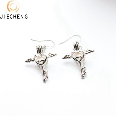 China Trendy Fashion Style Silver Plated Cage Gorgeous Pearl Rice Lady's Hanging Earrings Design Latest Pearl Earrings for sale