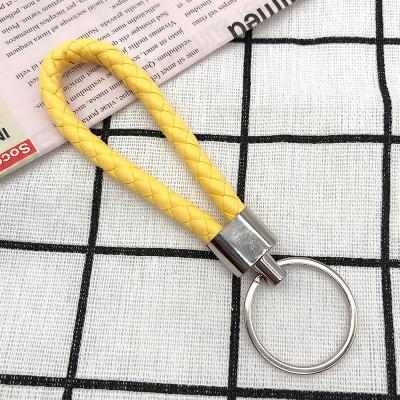 China 23 Color Eco-friendly Factory Handmade Car Logo Brand Key Chain Woven Braided Roap Leather Key Chain Accessories For Car Keys for sale