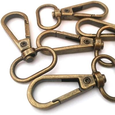 China Antique Brass Purse Swivel Lobster Claw Clasps Snap Purse Lanyard Clip Door Classic Trigger Push Hooks for sale