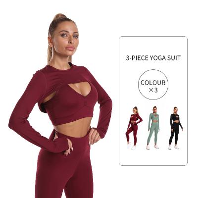 China Breathable Wholesale Workout Outfits For Women 3 Piece Long Sleeve Cutout Crop Tops And High Waist Yoga Pants Seamless Yoga Set 2021 for sale