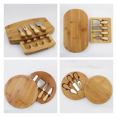 China Sustainable Bamboo Cheese Board Charcuterie Board Set with Cutlery - Slide Drawer - Includes 4 Stainless Steel Serving Utensils for sale