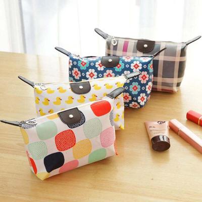 China Eco-friendly Ladies Cosmetic Bag Travel Wash Bag Waterproof Pellets Folding Storage Bag for sale