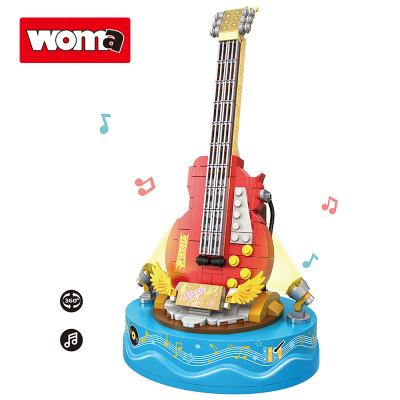 China Building Toy WOMA TOYS Girl Children Birthday Christmas Gifts Turn Game Music Box Guitar Assembly Building Blocks Bricks Model Toys for sale