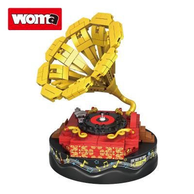 China Construction Toy WOMA TOYS Wish Hot Sale Kids Birthday Christmas Gifts Turn Yellow Game Music Box Phonograph Model Building Blocks Bricks Toys for sale