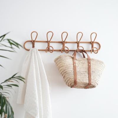 China Contemporary Vintage Rattan Hanger Kids Clothes Organizer Rack Children Hanger Kids Room Decoration Rattan Coat Hangs Wall Hanger for sale