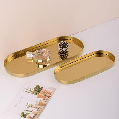 China Simple and modern creative gold oval tray decoration living room soft viable tea table to receive fruit bowl decorations for sale