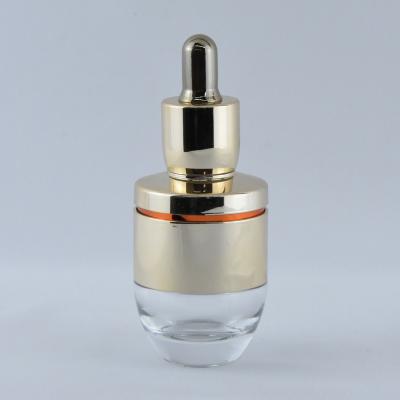 China Luxury Custom Cosmetic 30ml Dropper Glass Bottle For Essential Oil With Gold Flat Cap Push Button Shoulder And Nitrile Rubber Teat for sale