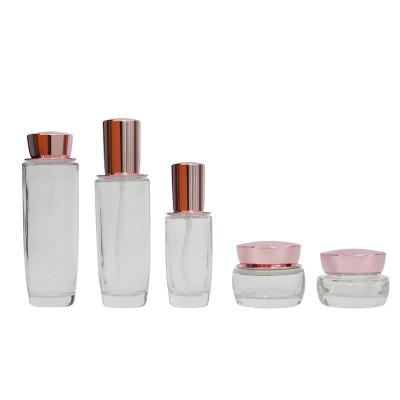 China Cosmetic set 30g 50g 40ml 100ml 120ml skin care packaging set of glass bottle and clear cosmetic jars with lids for sale