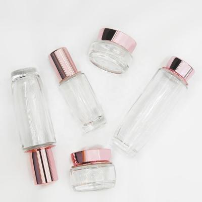 China Cosmetic Jar 30G 50G 40ML 100ML 120ML Cosmetic Glass Pink Lotion Bottle For Pink Cosmetic Packaging Set for sale