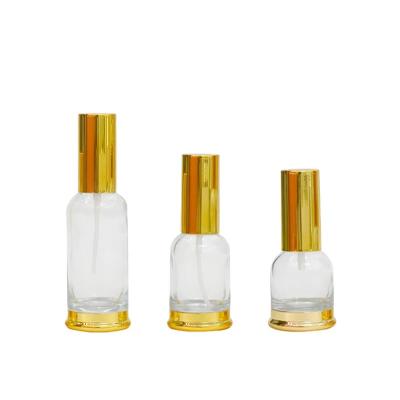 China Fine 20ml 30ml 50ml Perfume Spray Round Clear Glass Empty Refillable Cosmetic Bottle Lotion Bottle Press Pump Bottle for sale