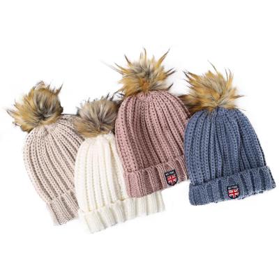 China COMMON autumn and winter applique embroidery wool ball knitted hat women's new slapped hat for sale